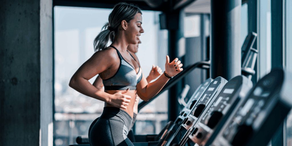 Women on treadmill signifying the return of Cardio focused workouts.  Image that is part of 20 Wellness Trends for 2026.